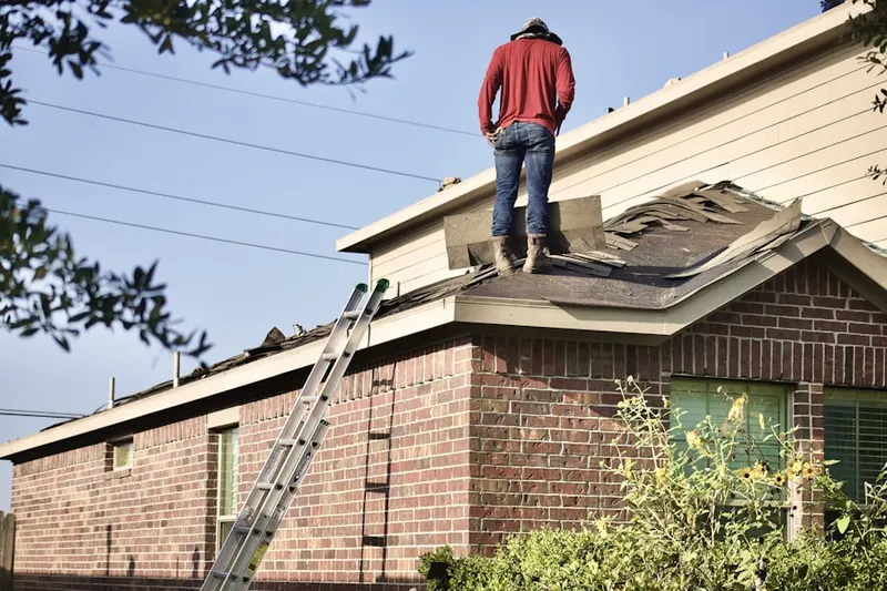 Professional roofer working on a residential roof in Lakeview Estates